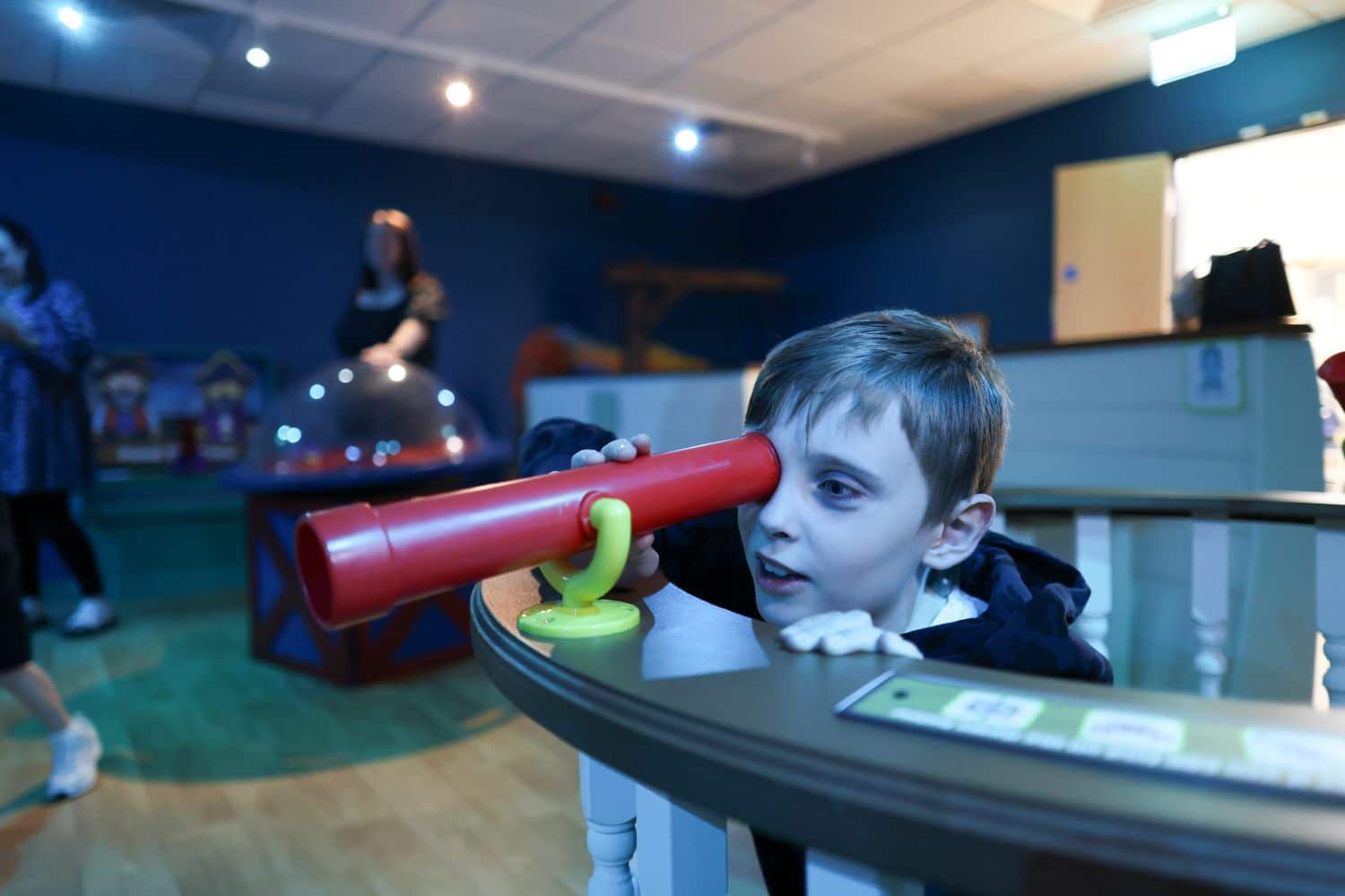 Child with telescope at Captain Cook Birthplace Museum